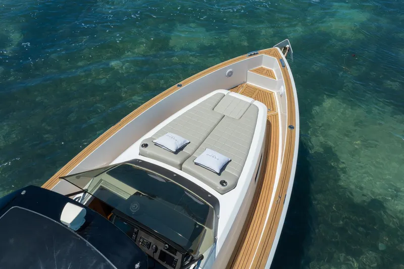 Slide: The Image of 2020 Pardo Yachts 38 with sleek deck design on clear blue water. - 28