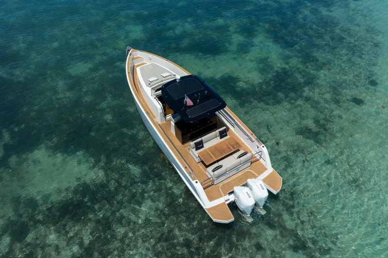 Slide: The Image of 2020 Pardo Yachts 38 cruising in clear turquoise waters, showcasing sleek design and luxury. - 30