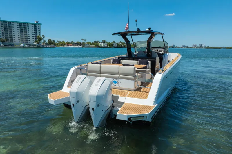 Slide: The Image of 2020 Pardo Yachts 38 on water, featuring dual outboard engines and sleek design. - 32