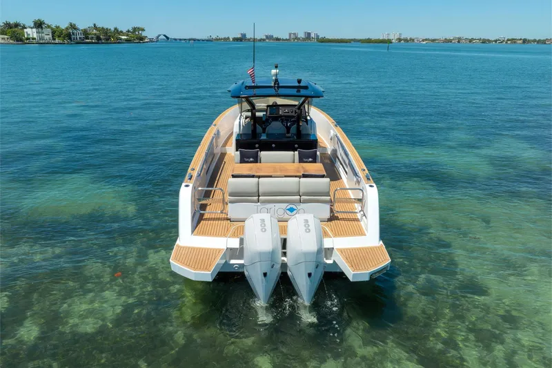 Slide: The Image of 2020 Pardo Yachts 38 on clear blue water, showcasing sleek design and twin engines. - 33