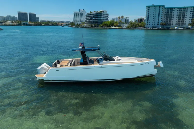 Slide: The Image of 2020 Pardo Yachts 38 in clear blue water near urban skyline. - 36