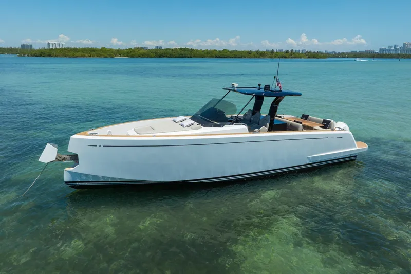 Slide: The Image of 2020 Pardo Yachts 38 anchored in clear turquoise waters, showcasing sleek design. - 38