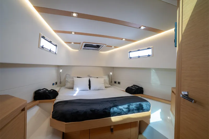 Slide: The Image of Luxurious cabin interior of 2020 Pardo Yachts 38, featuring modern design and cozy bedding. - 4