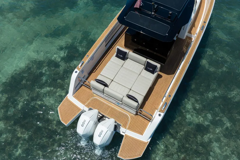 Slide: The Image of Aerial view of 2020 Pardo Yachts 38 with twin engines on clear water. - 6