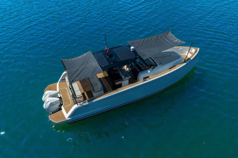 Slide: The Image of 2020 Pardo Yachts 38 cruising on clear blue water, featuring sleek design and twin engines. - 7