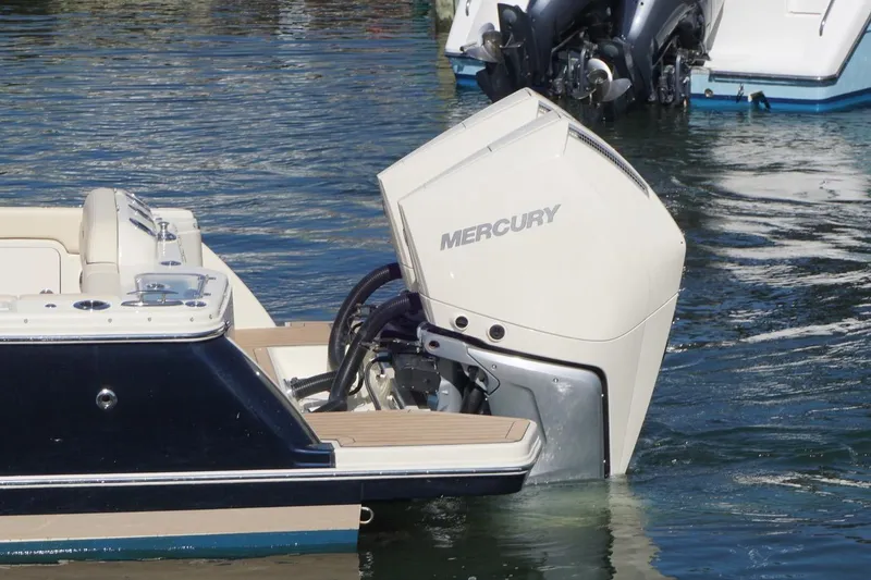 Slide: The Image of 2025 Chris-Craft Calypso 28 with Mercury outboard engine on water. - 10