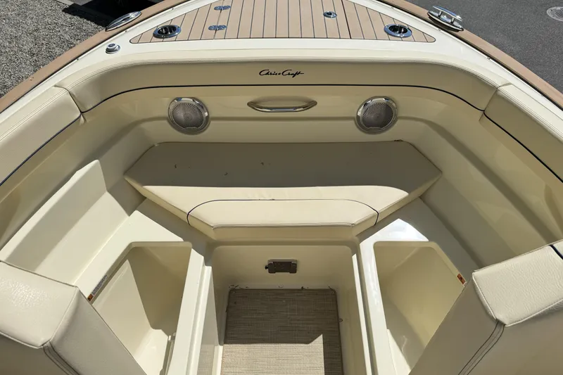 Slide: The Image of 2025 Chris-Craft Calypso 28 boat interior with beige seating and wood accents. - 18