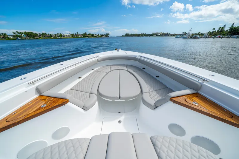 Slide: The Image of Luxurious 2027 HCB 65 Estrella boat interior with elegant seating and scenic water view. - 21