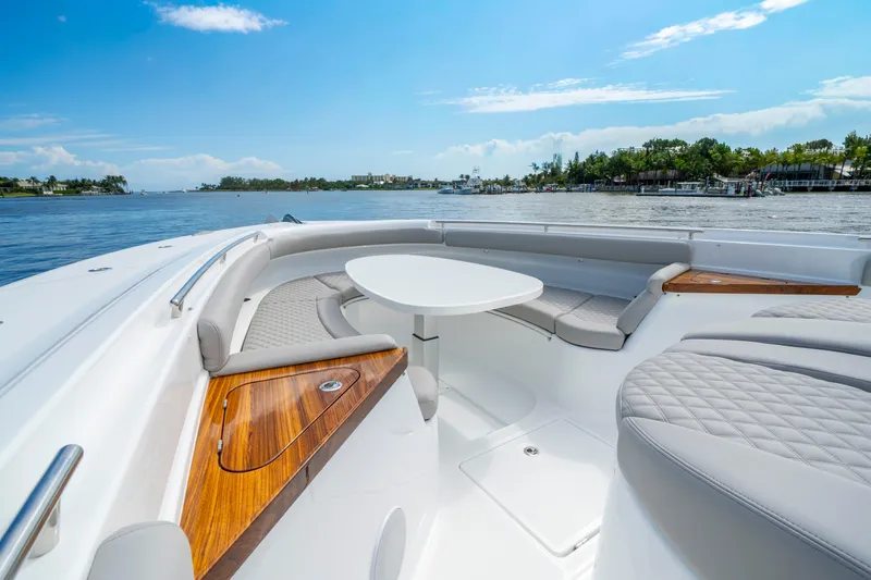 Slide: The Image of Luxurious seating area on 2027 HCB 65 Estrella yacht with scenic water view. - 23