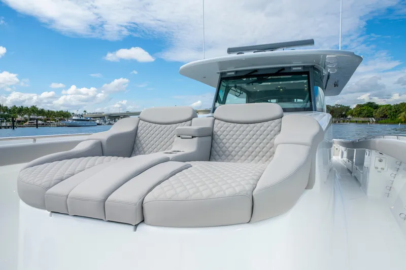 Slide: The Image of Luxurious seating on 2027 HCB 65 Estrella yacht, featuring quilted upholstery and sleek design. - 26