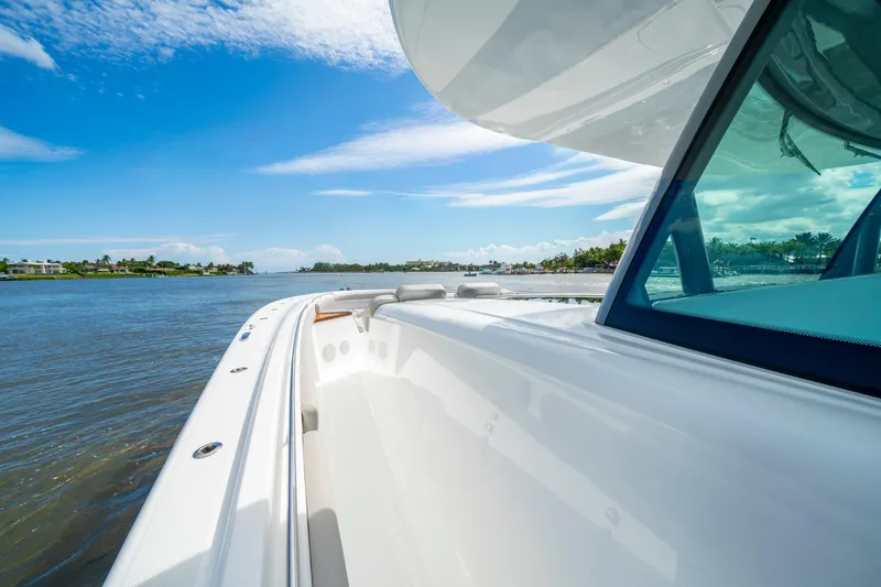 Slide: The Image of 2027 HCB 65 Estrella yacht cruising on a sunny day, showcasing sleek design and luxury. - 30