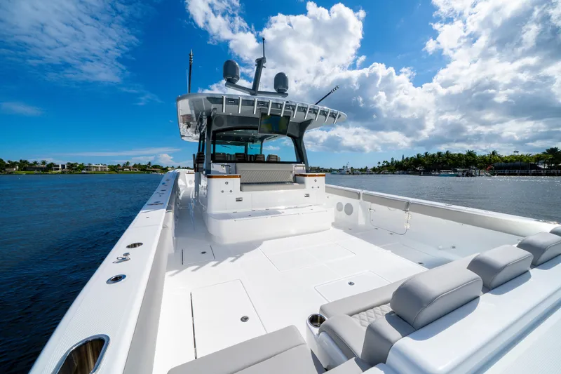 Slide: The Image of Luxurious 2027 HCB 65 Estrella yacht on calm waters under a vibrant blue sky. - 37