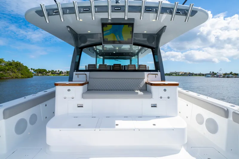 Slide: The Image of 2027 HCB 65 Estrella luxury boat interior with seating, ocean view, and modern design. - 38