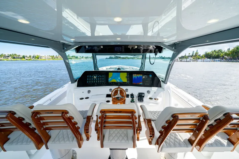 Slide: The Image of Luxurious 2027 HCB 65 Estrella yacht cockpit with advanced navigation displays and elegant seating. - 48