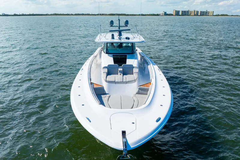 Slide: The Image of 2027 HCB 65 Estrella luxury yacht on open water, showcasing sleek design and spacious deck. - 5