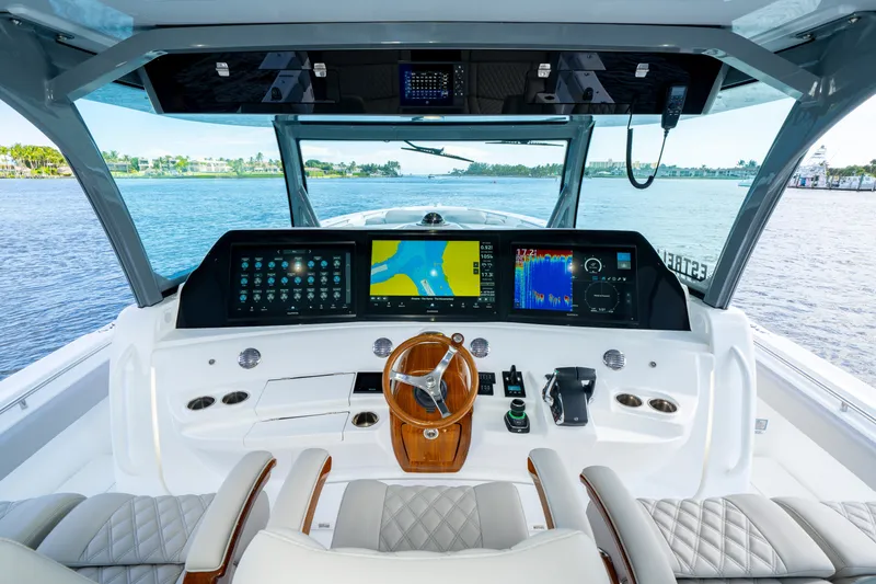 Slide: The Image of Helm of 2027 HCB 65 Estrella yacht with advanced navigation displays and luxurious seating. - 50