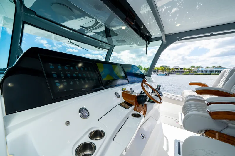 Slide: The Image of Luxurious helm of 2027 HCB 65 Estrella yacht with advanced navigation displays. - 55