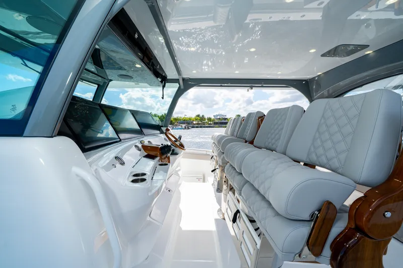 Slide: The Image of Luxurious interior of 2027 HCB 65 Estrella yacht with plush seating and advanced controls. - 56