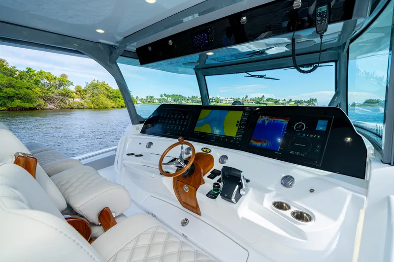 Slide: The Image of Luxurious 2027 HCB 65 Estrella yacht cockpit with advanced navigation systems and plush seating. - 57