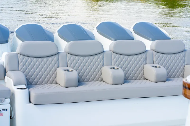 Slide: The Image of Luxurious seating on 2027 HCB 65 Estrella boat with quilted upholstery and cup holders. - 64