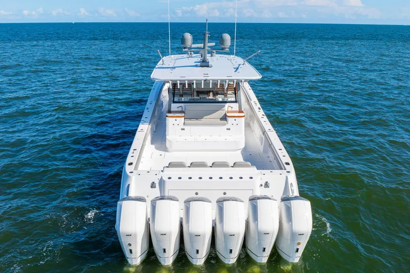 Slide: The Image of 2027 HCB 65 Estrella luxury yacht with multiple engines on open water. - 67