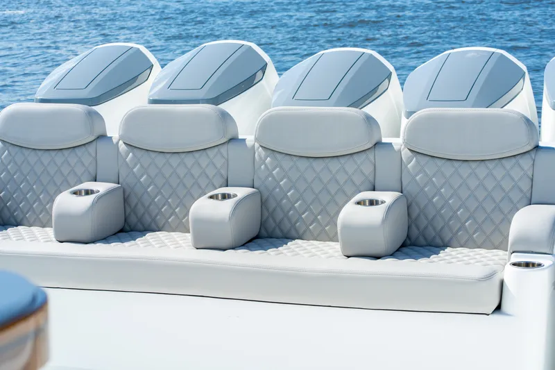 Slide: The Image of Luxurious seating on 2027 HCB 65 Estrella boat with quilted upholstery and cup holders. - 71