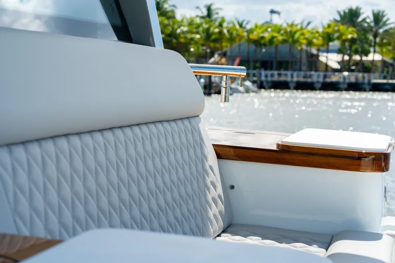 Slide: The Image of Luxurious seating on the 2027 HCB 65 Estrella yacht, with waterfront view. - 73