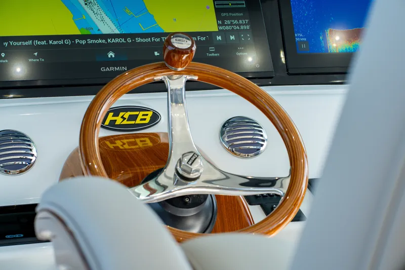 Slide: The Image of Steering wheel of 2027 HCB 65 Estrella boat with navigation display. - 80