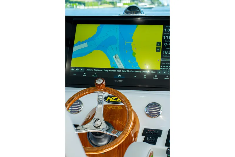 Slide: The Image of Helm of 2027 HCB 65 Estrella with navigation display and wooden steering wheel. - 81