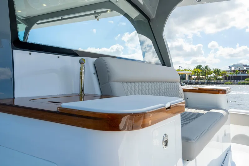 Slide: The Image of Luxurious seating area on the 2027 HCB 65 Estrella yacht, featuring elegant wood accents. - 84