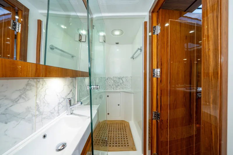 Slide: The Image of Luxurious bathroom interior of 2027 HCB 65 Estrella yacht with marble and wood finishes. - 91