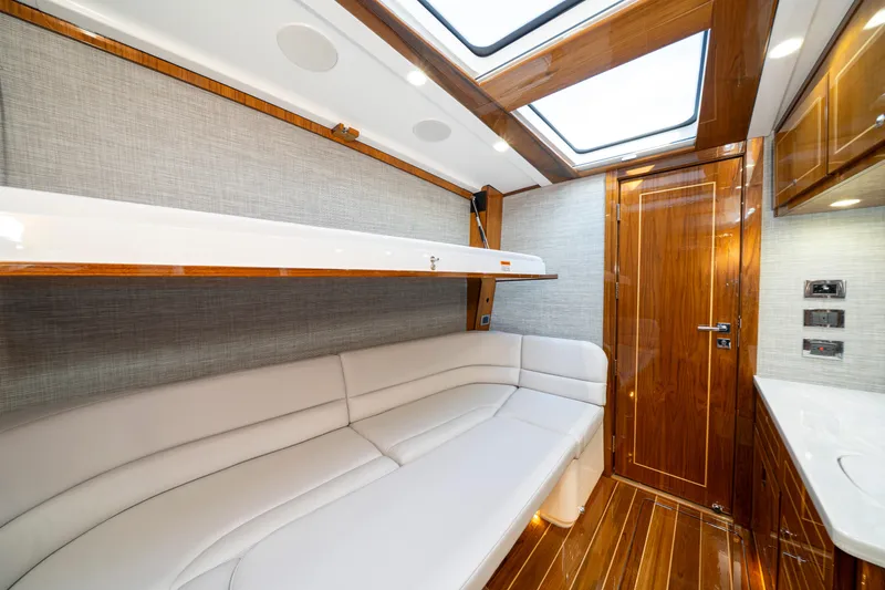 Slide: The Image of Luxurious interior of 2027 HCB 65 Estrella yacht with elegant wood finishes and plush seating. - 92