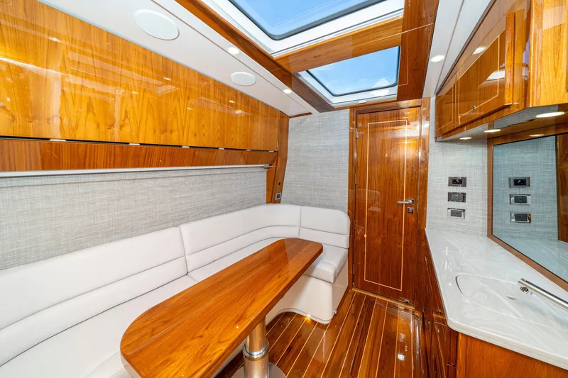 Slide: The Image of Luxurious interior of 2027 HCB 65 Estrella yacht with wood finishes and skylight. - 94