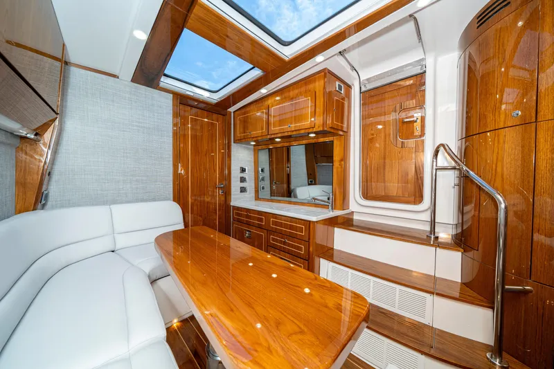Slide: The Image of Luxurious interior of 2027 HCB 65 Estrella yacht with elegant wood finishes and skylight. - 95