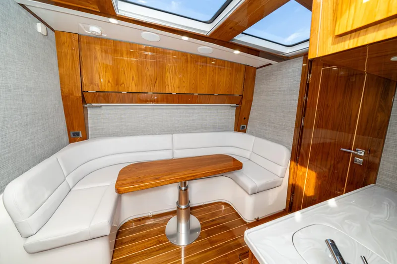 Slide: The Image of Luxurious interior of 2027 HCB 65 Estrella yacht with elegant wood and leather seating. - 97
