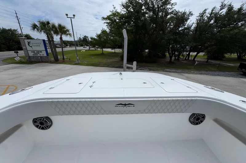 Slide: The Image of 2020 Invincible 35 Catamaran at Grander Marine dealership, surrounded by trees. - 19