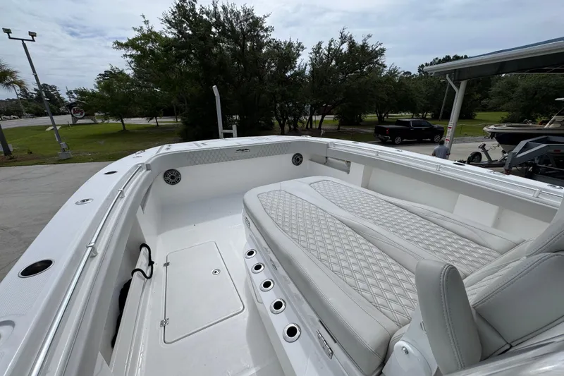 Slide: The Image of 2020 Invincible 35 Catamaran interior with white cushioned seating and sleek design. - 20