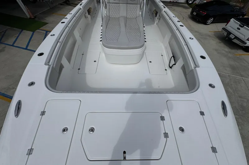 Slide: The Image of 2020 Invincible 35 Catamaran boat interior with seating and storage compartments. - 21