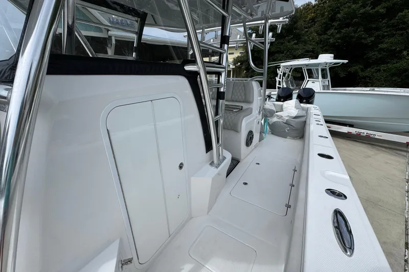 Slide: The Image of 2020 Invincible 35 Catamaran interior with seating and storage compartments. - 26