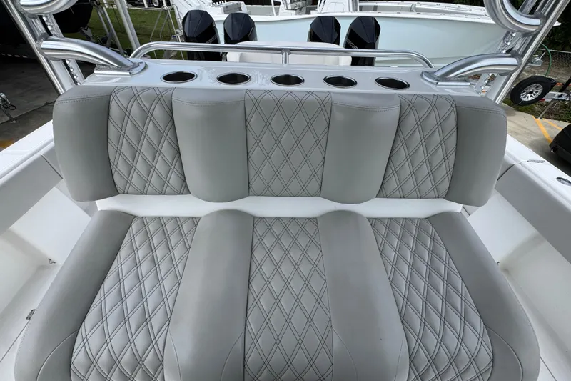 Slide: The Image of Luxury seating on 2020 Invincible 35 Catamaran with diamond-stitched upholstery and cup holders. - 29