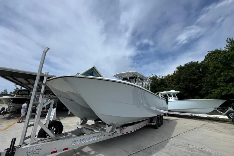 Slide: The Image of 2020 Invincible 35 Catamaran on trailer under cloudy sky at marina. - 4