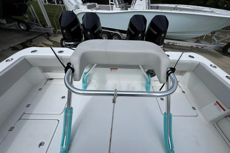 Slide: The Image of 2020 Invincible 35 Catamaran with Mercury engines, featuring a spacious deck and seating area. - 41