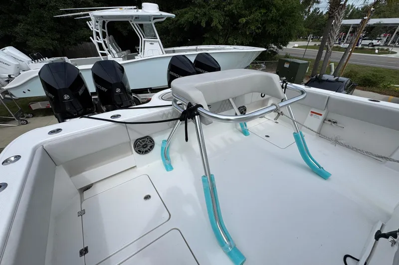 Slide: The Image of 2020 Invincible 35 Catamaran with dual Mercury engines, featuring a spacious deck layout. - 42