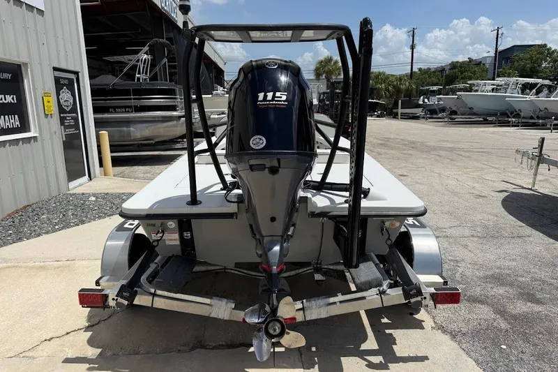 Slide: The Image of 2023 Maverick 18 HPX-V boat on trailer with 115 HP engine, outdoor setting. - 10