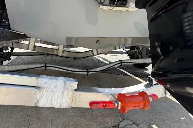 Slide: The Image of 2023 Maverick 18 HPX-V boat trailer detail with orange roller and wrapped section. - 11