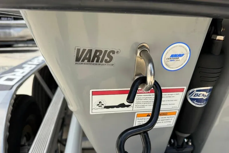 Slide: The Image of 2023 Maverick 18 HPX-V boat featuring VARIS technology and certification labels. - 12