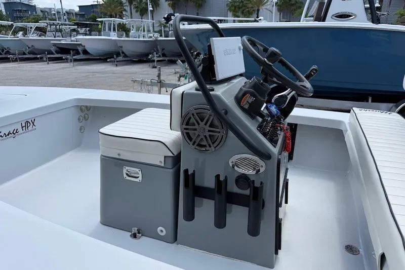 Slide: The Image of 2023 Maverick 18 HPX-V boat interior with steering console and seating. - 14