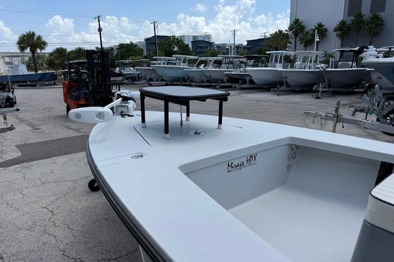 Slide: The Image of 2023 Maverick 18 HPX-V boat in a marina, showcasing sleek design and spacious deck. - 15