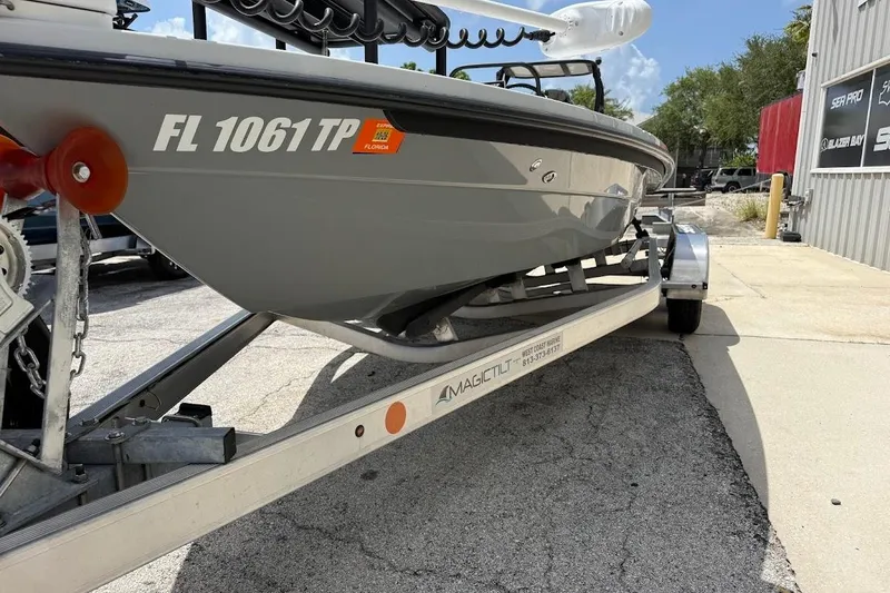 Slide: The Image of 2023 Maverick 18 HPX-V boat on trailer, parked outdoors with Florida registration. - 3