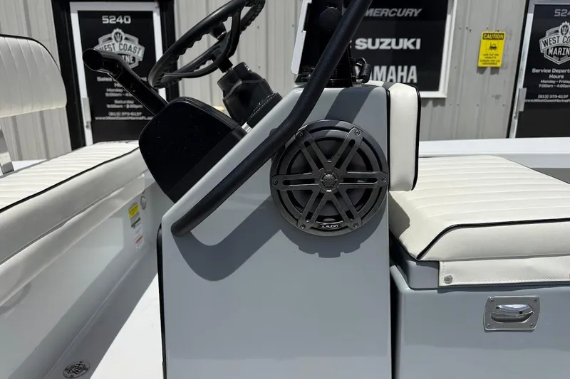 Slide: The Image of 2023 Maverick 18 HPX-V boat interior with steering wheel and speaker detail. - 8